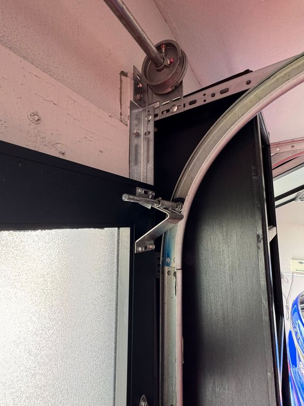 A close up of a garage door with the door open.