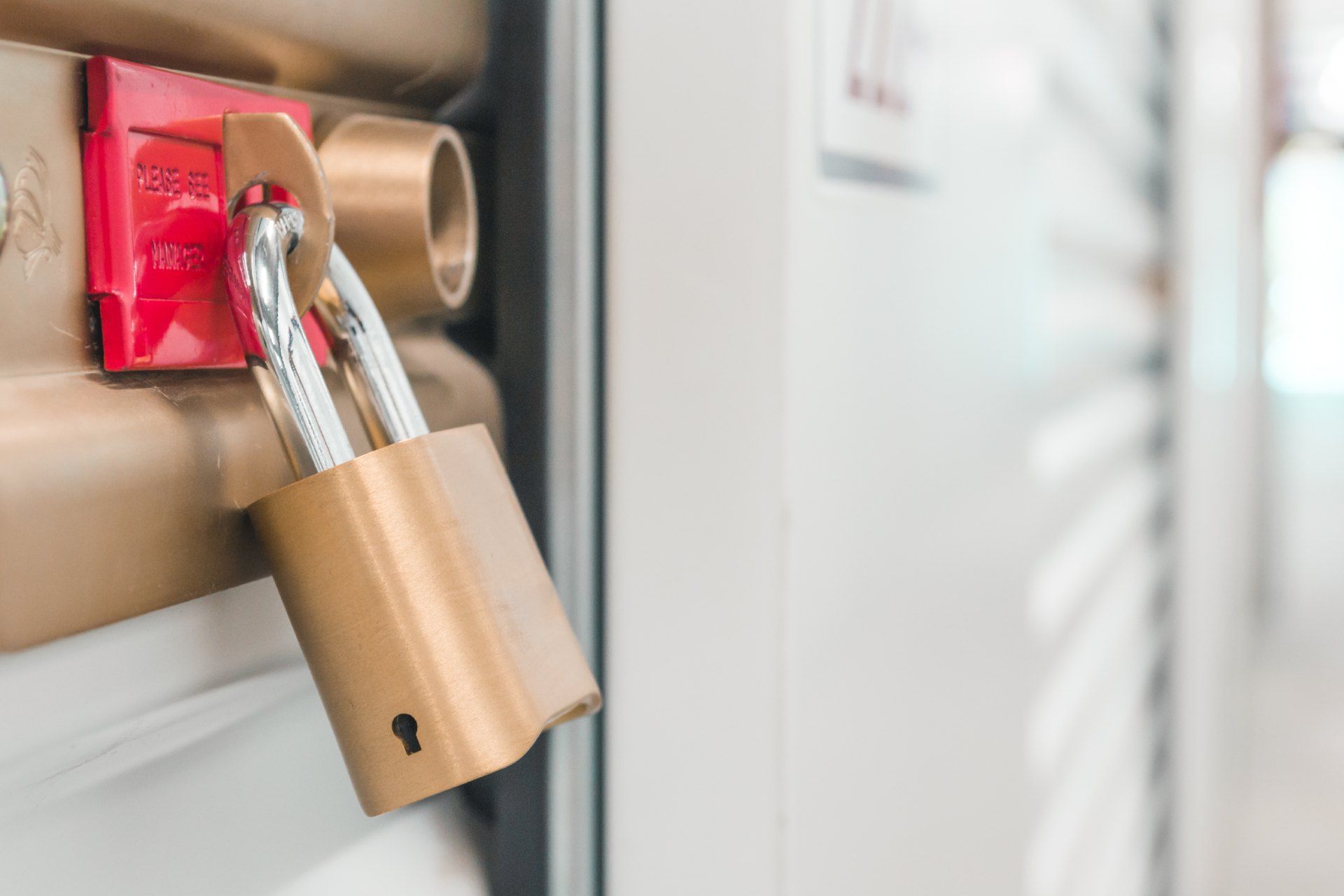 A close up of a padlock on a door.