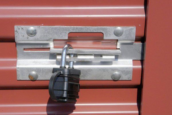 A red door with a padlock on it