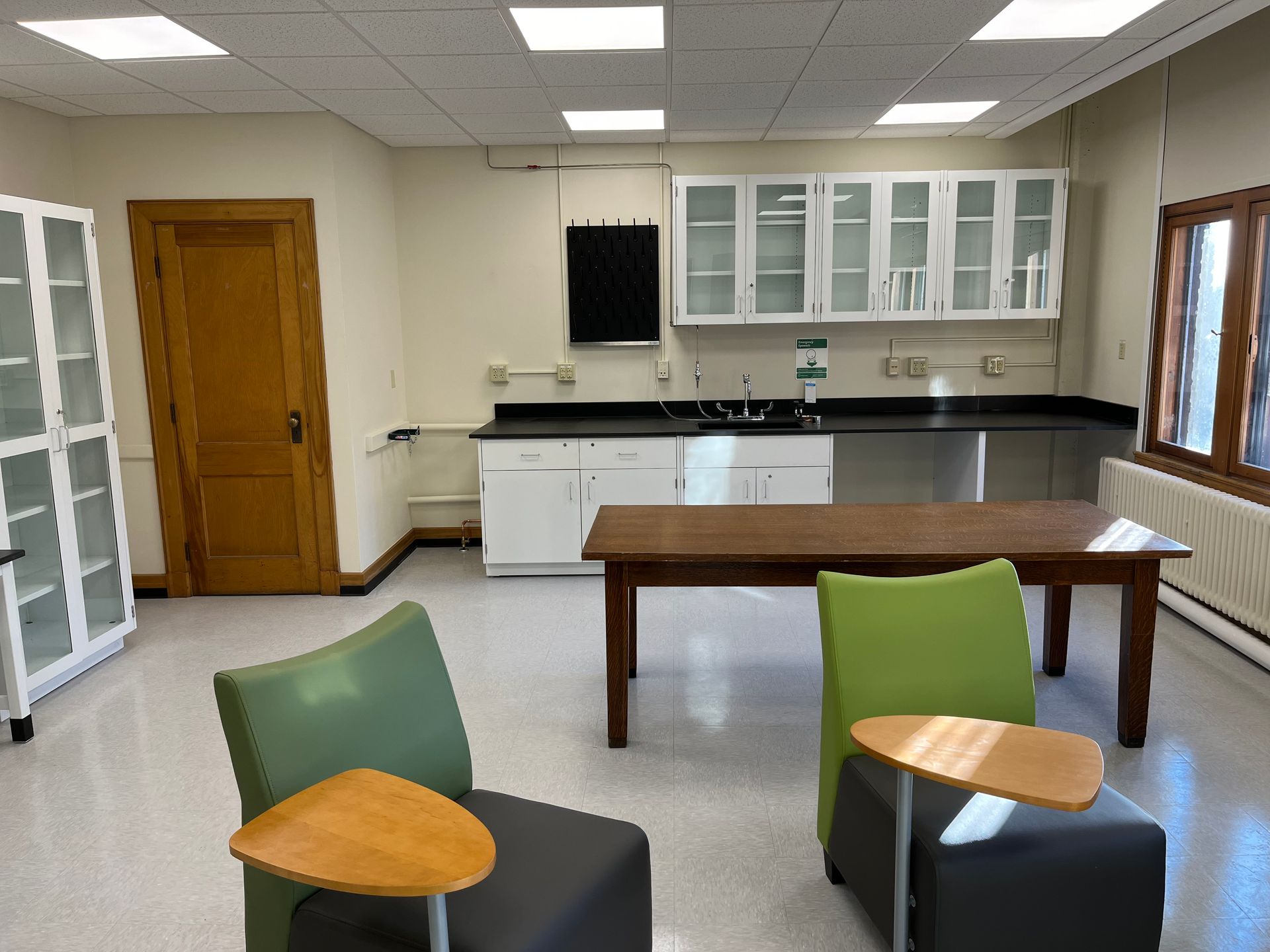 A room with a table and chairs in it