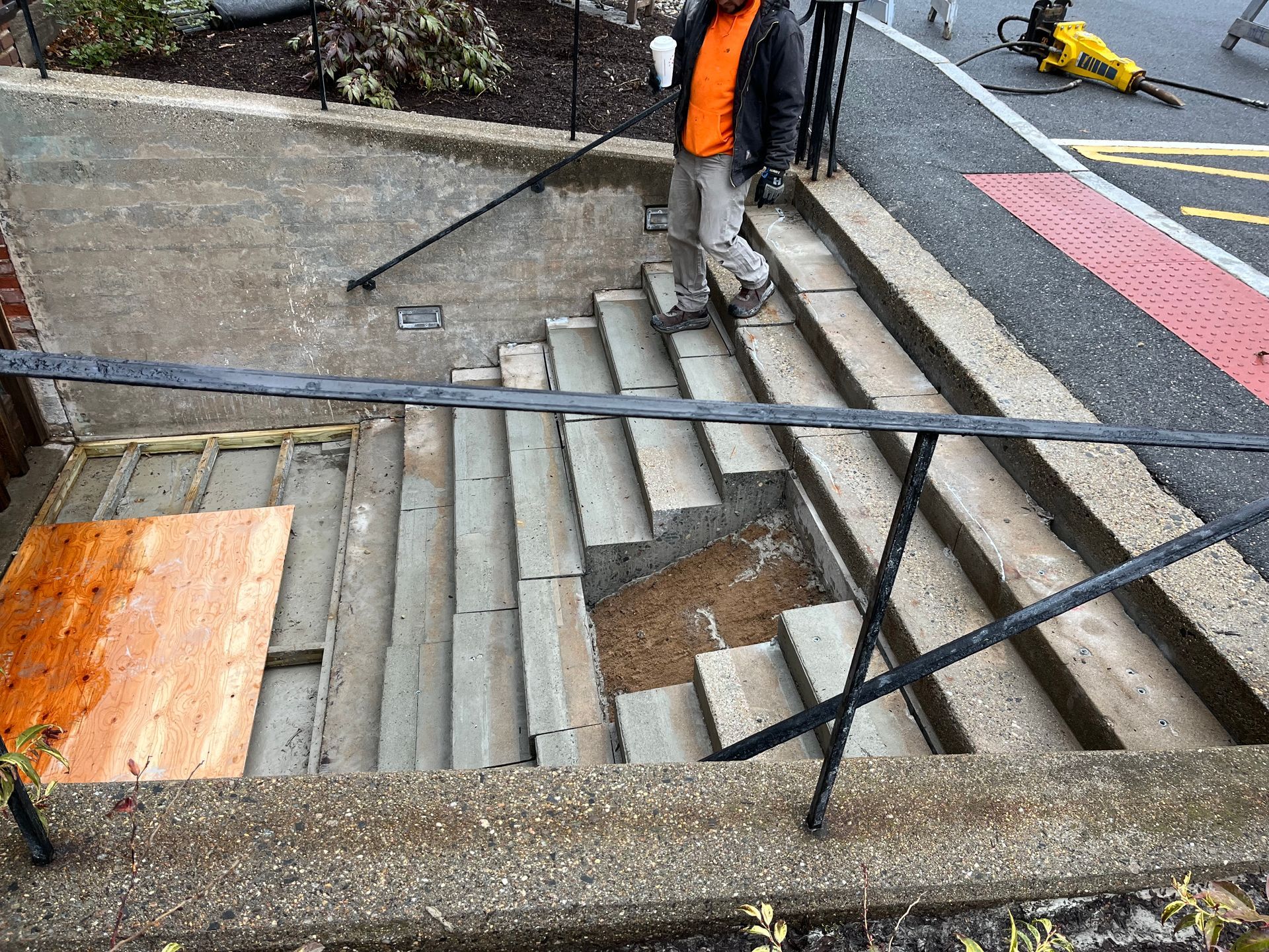 A man is standing on a set of stairs.