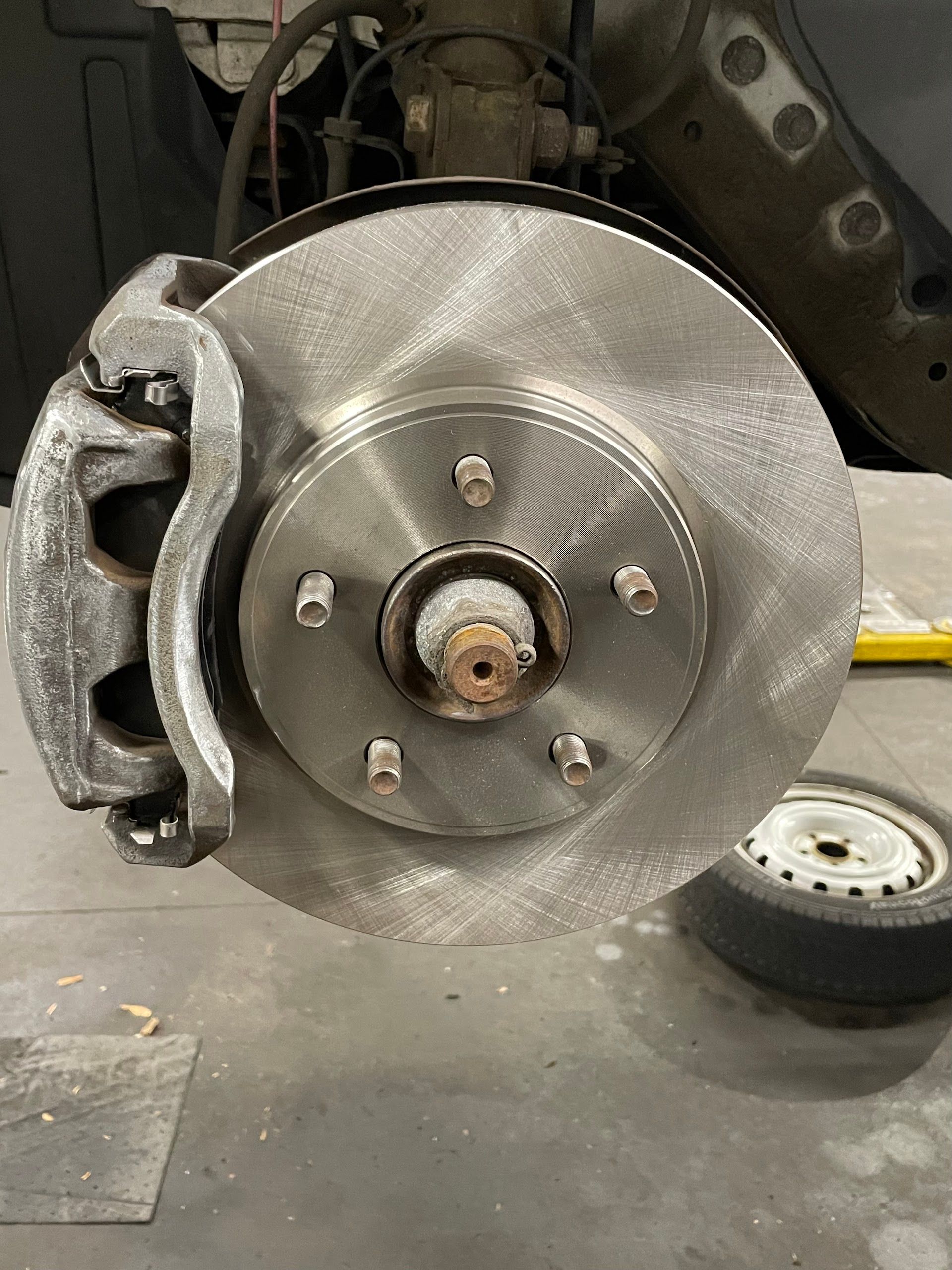 Close-Up of Car Brake Rotor and Caliper | EASE Auto Service