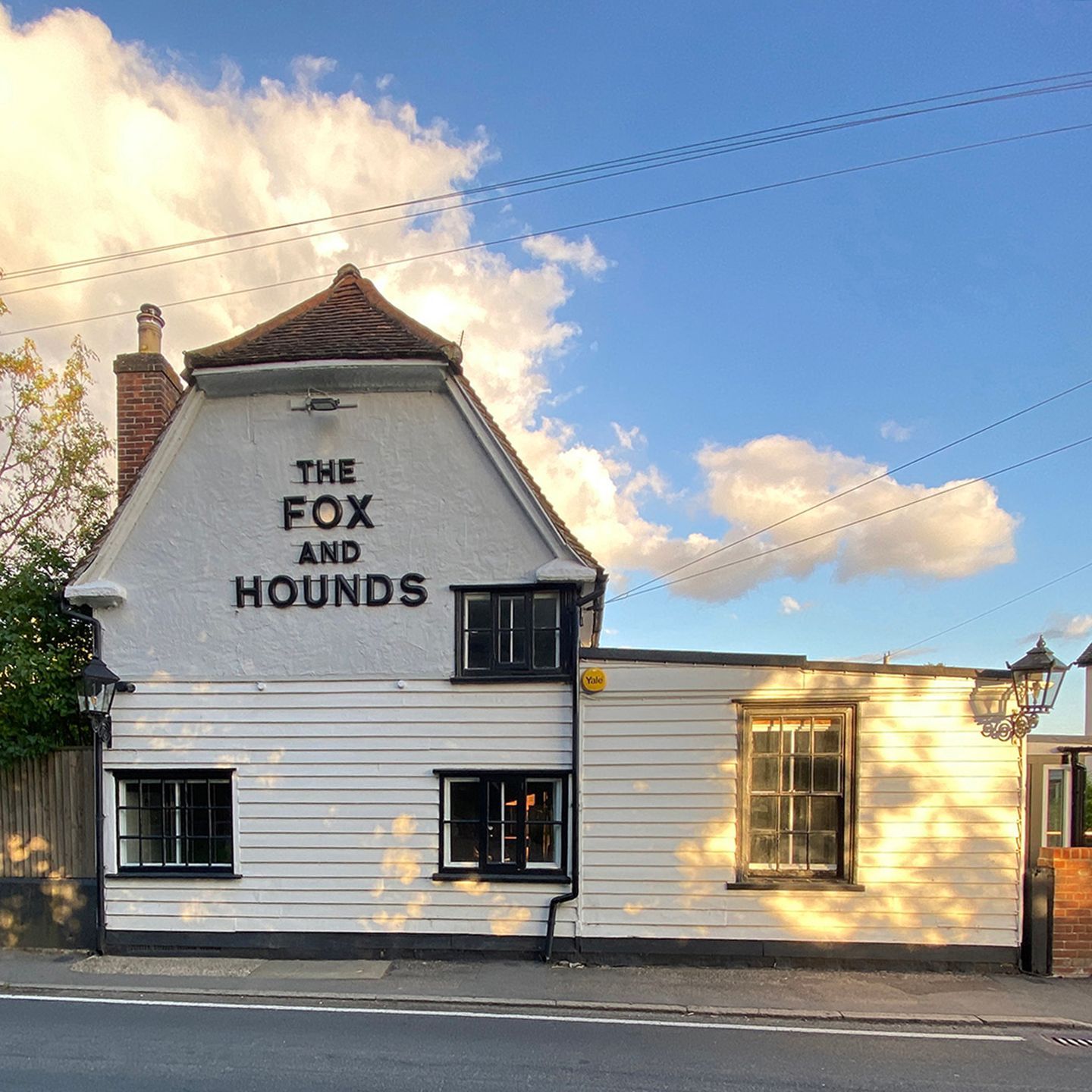 The front of The Fox and Hounds pub from the roadside