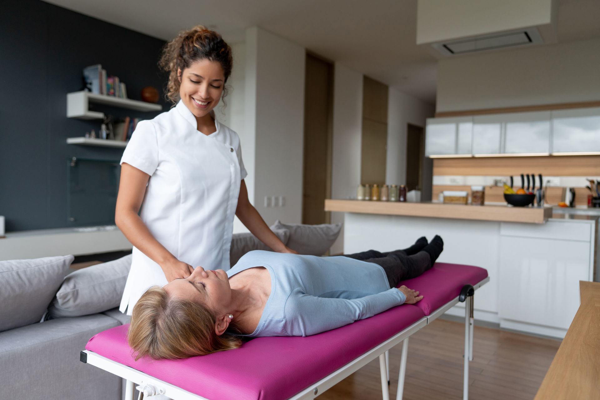 Woman Laying On Table Getting A Massage — Fairview, MO — Country Comfort Treatment Center 