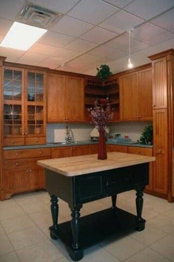 Kitchen Layouts - Home Kitchen Interior with Wood Cabinets and Table in Harrison, NJ