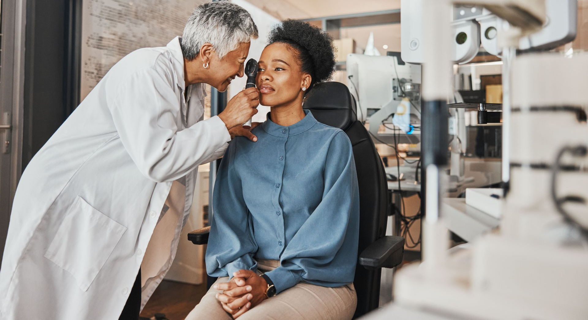 A woman is getting her eye checked. A woman is getting her eye checked.