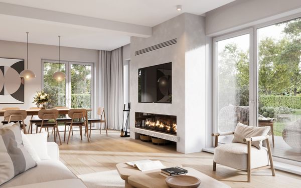 Modern living room with fireplace, dining area, and large windows overlooking a green outdoor space.
