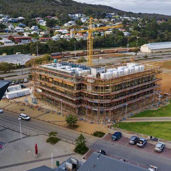 An aerial view of a building under construction in a city