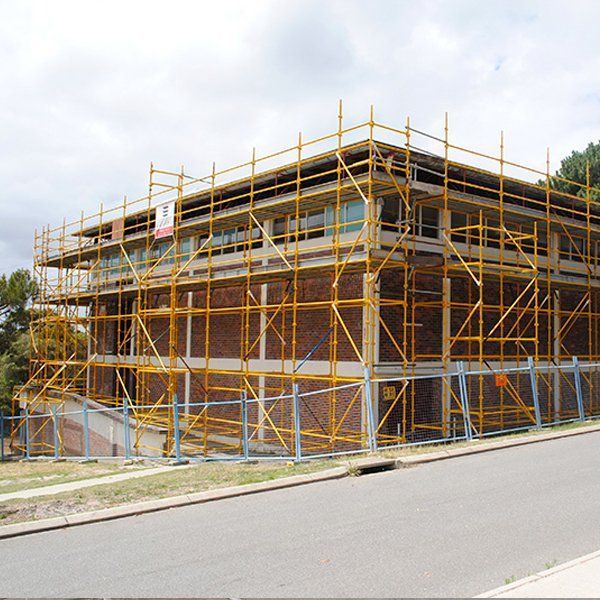 A large building under construction with scaffolding around it