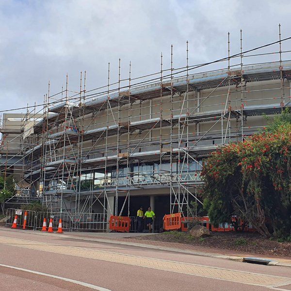 A large building is being built with scaffolding around it.