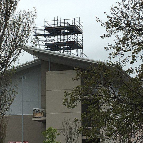 A large building with scaffolding on top of it.
