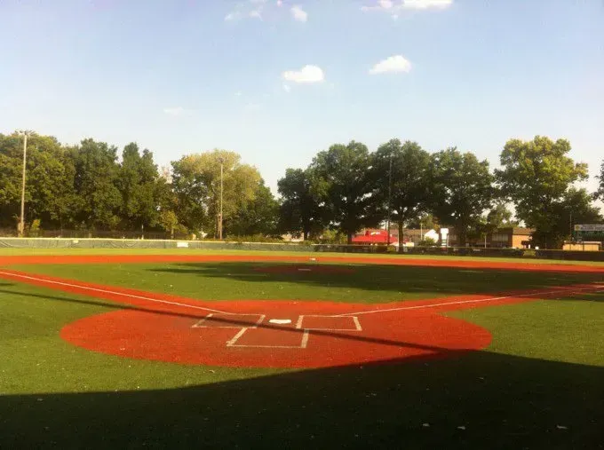 A baseball field with a red circle in the middle of it