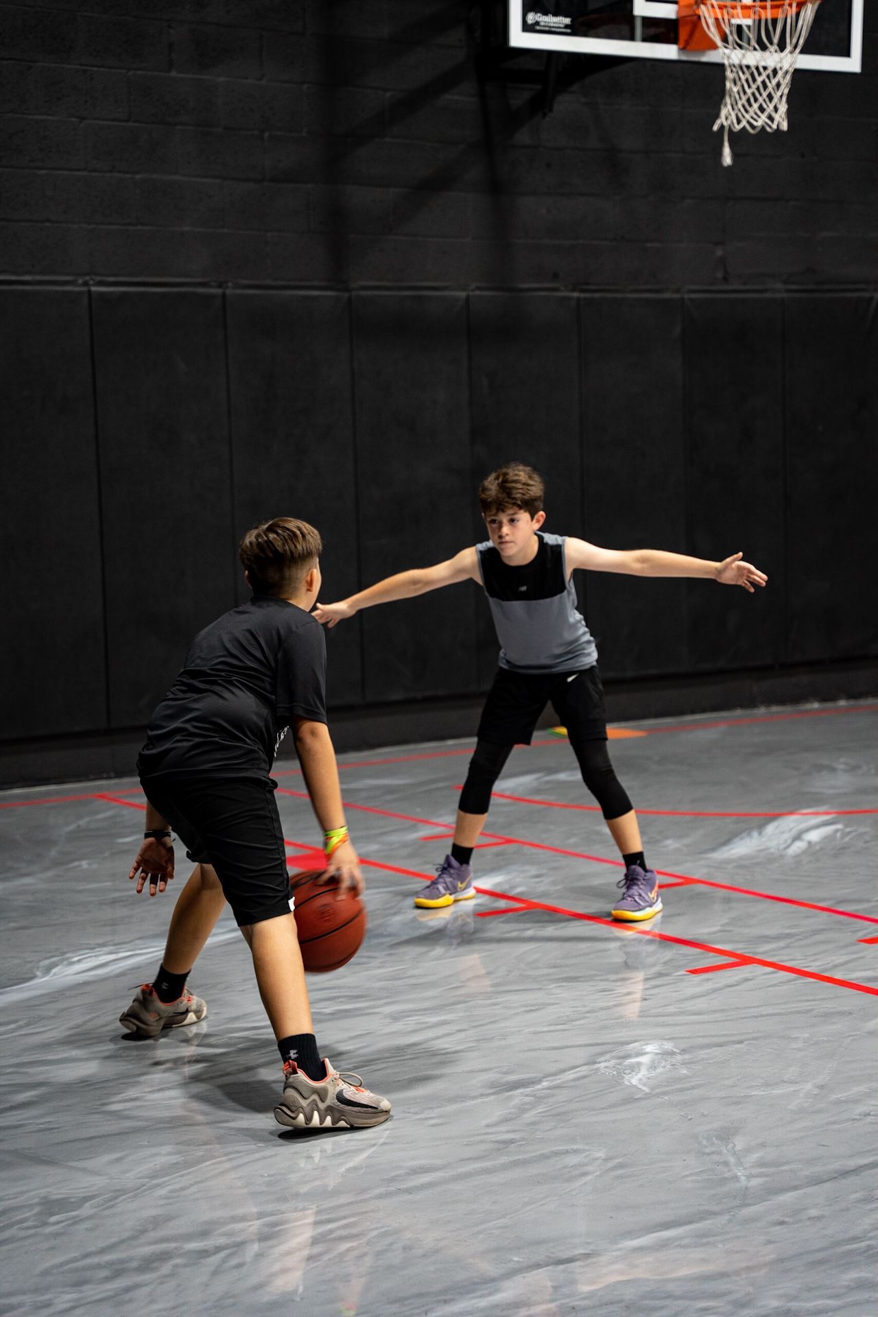 Youth basketball players training during a Pinecrest practice session at Vice City Basketball Academy, focusing on skill development and teamwork.