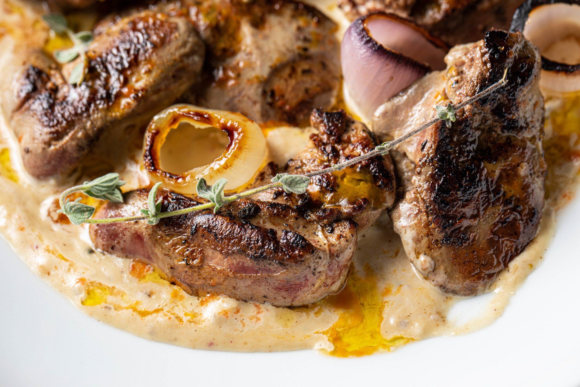 Pan fried chicken livers and burnt onions with tahini
