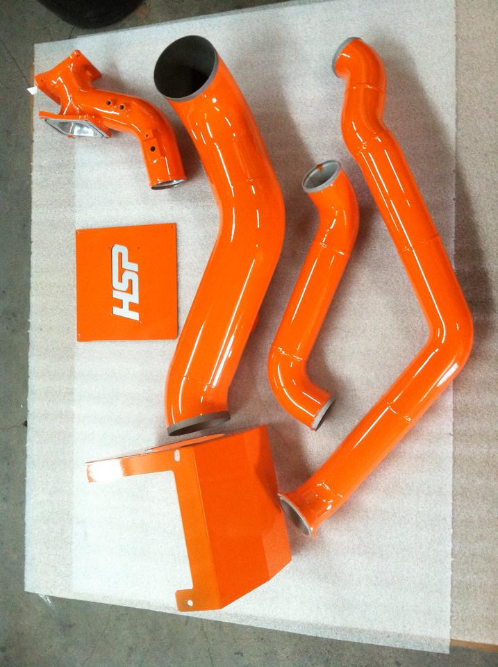 A set of orange pipes with the letters hsp on them