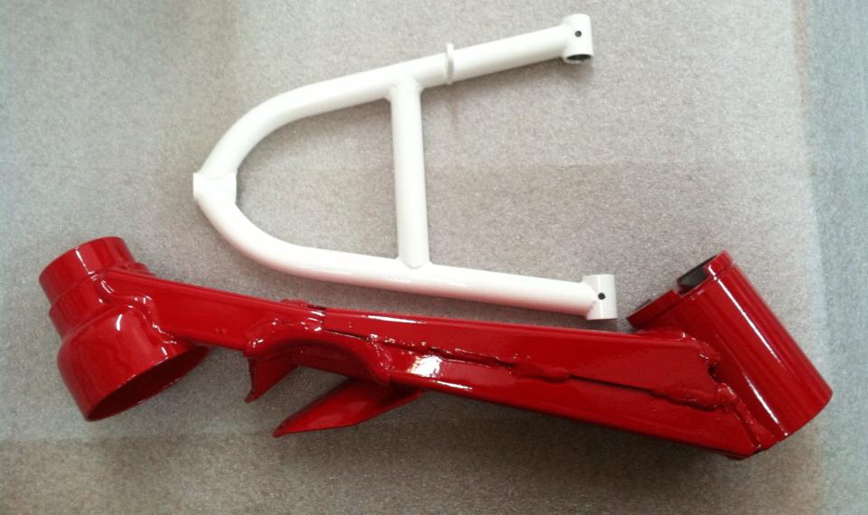 A red and white piece of metal sitting on a table