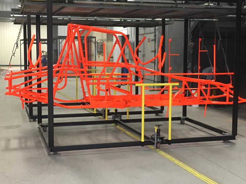 A large orange metal structure with a yellow railing