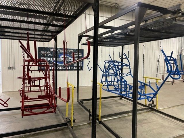 A bunch of metal frames are sitting in a room.