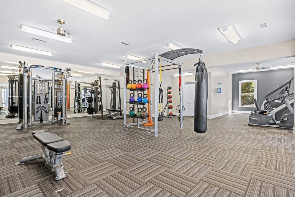a large gym filled with lots of exercise equipment at Marquis on Edwards Mill in Raleigh, NC. 