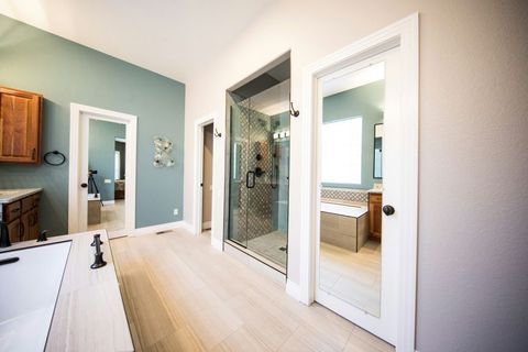 Frameless glass shower door professionally installed in a modern Boise, ID bathroom by A1 Handyman.
