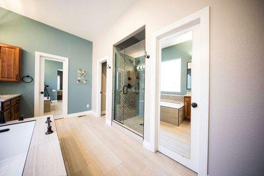 Frameless glass shower door professionally installed in a modern Boise, ID bathroom by A1 Handyman.