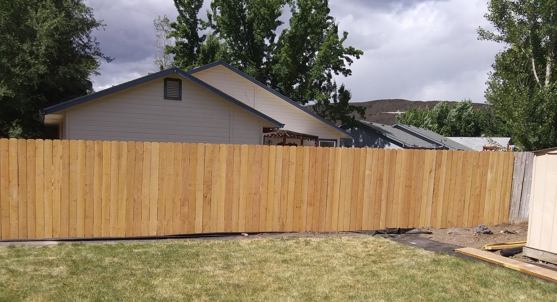 Repaired wooden fence section restoring stability and privacy in a Boise backyard
