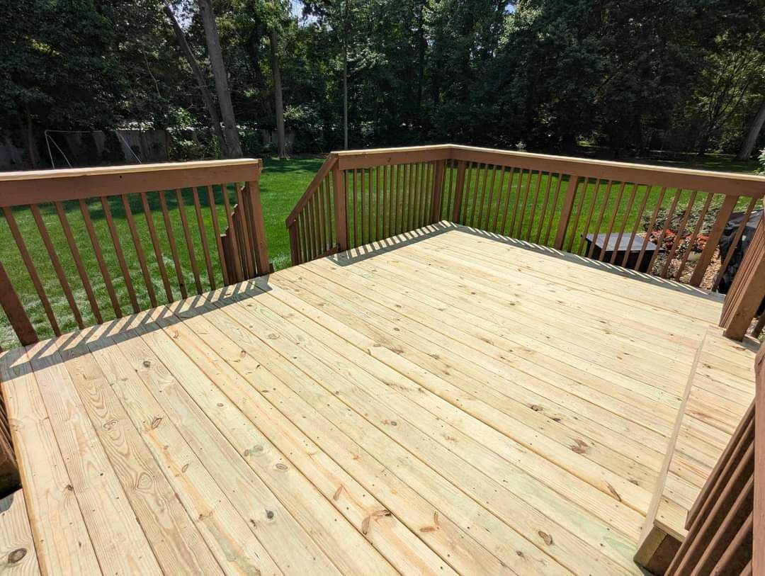 Deck Installation and repair over looking backyard 