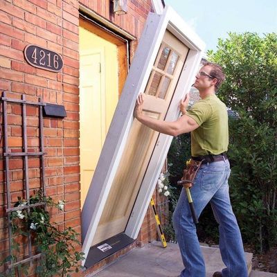 A1 Handyman Boise technician installing a new front entry door for a residential home as part of professional door repair and replacement services.
