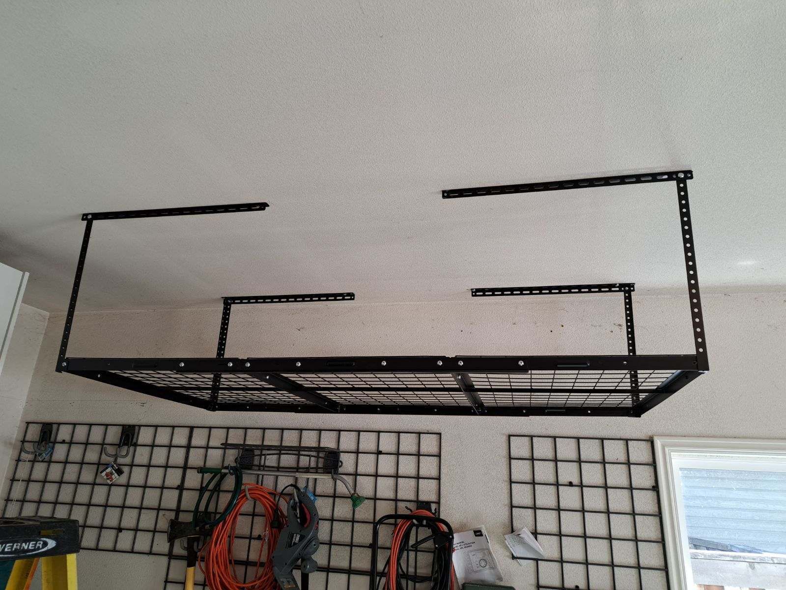 Overhead garage storage rack assembled and securely mounted by a professional furniture assembly service in Boise, ID