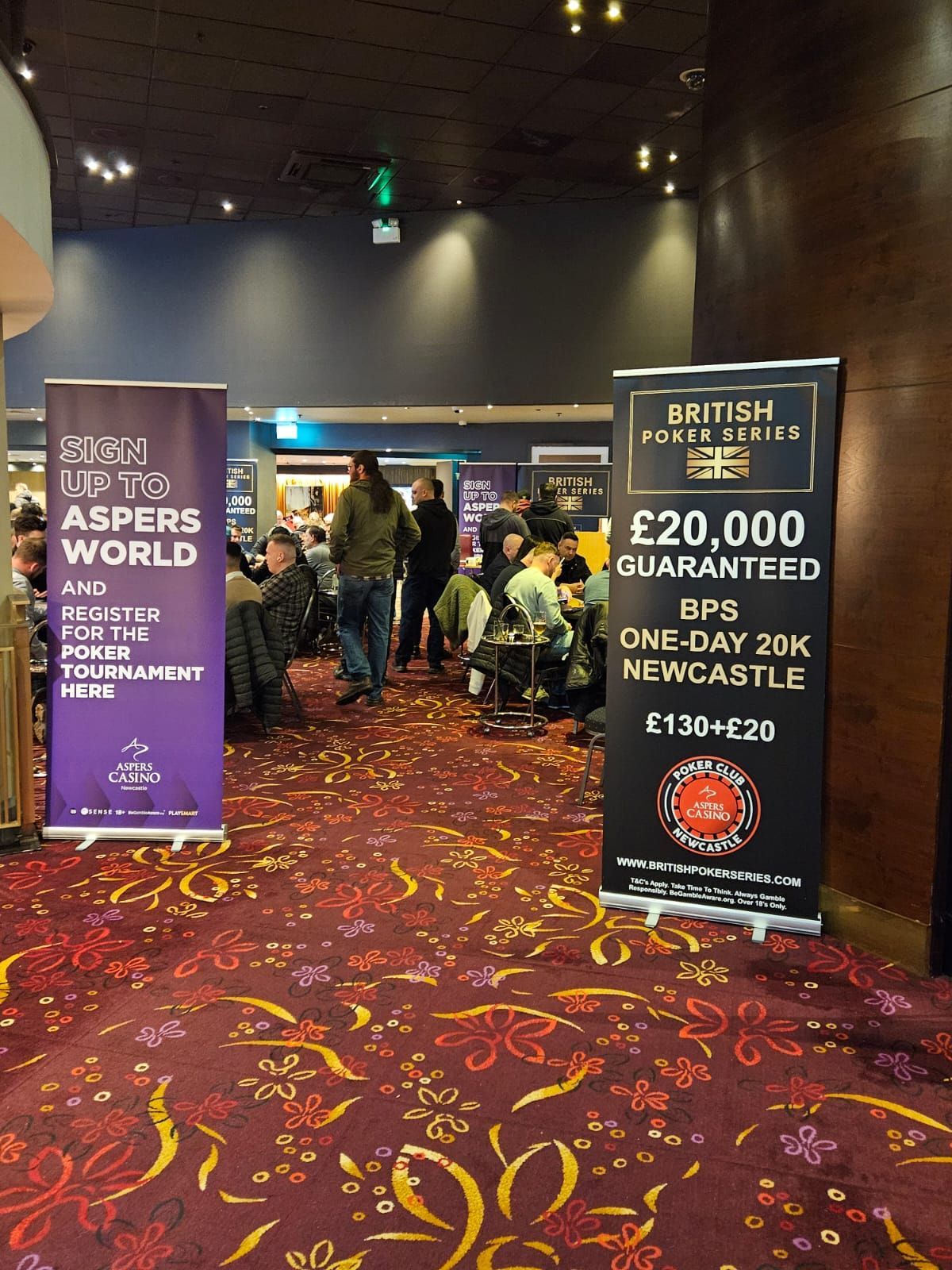 Two banners in a casino advertising a poker tournament at Aspers World, Newcastle.