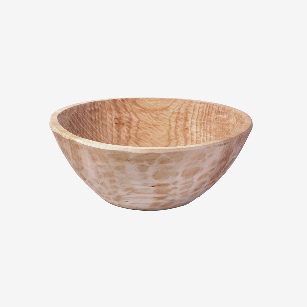 Wooden bowl with light-colored wood grain, isolated on white.