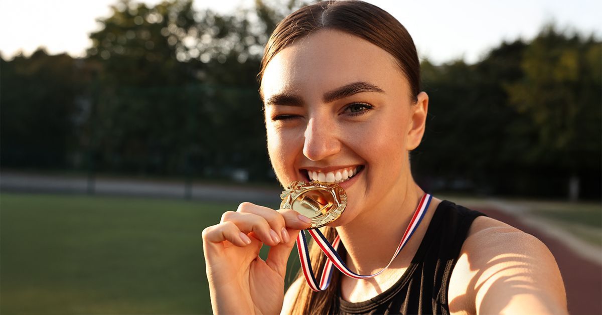 Gold medal moment symbolizing practice success and attracting the right dental patients