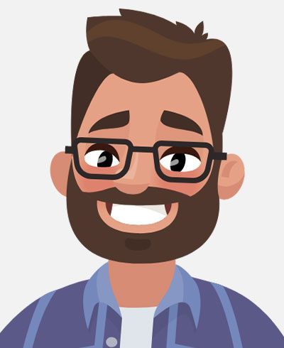 A man with a beard and glasses is smiling.