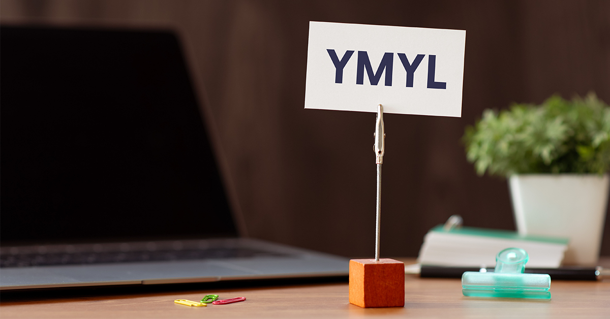 A small sign on a desk stand displaying the text