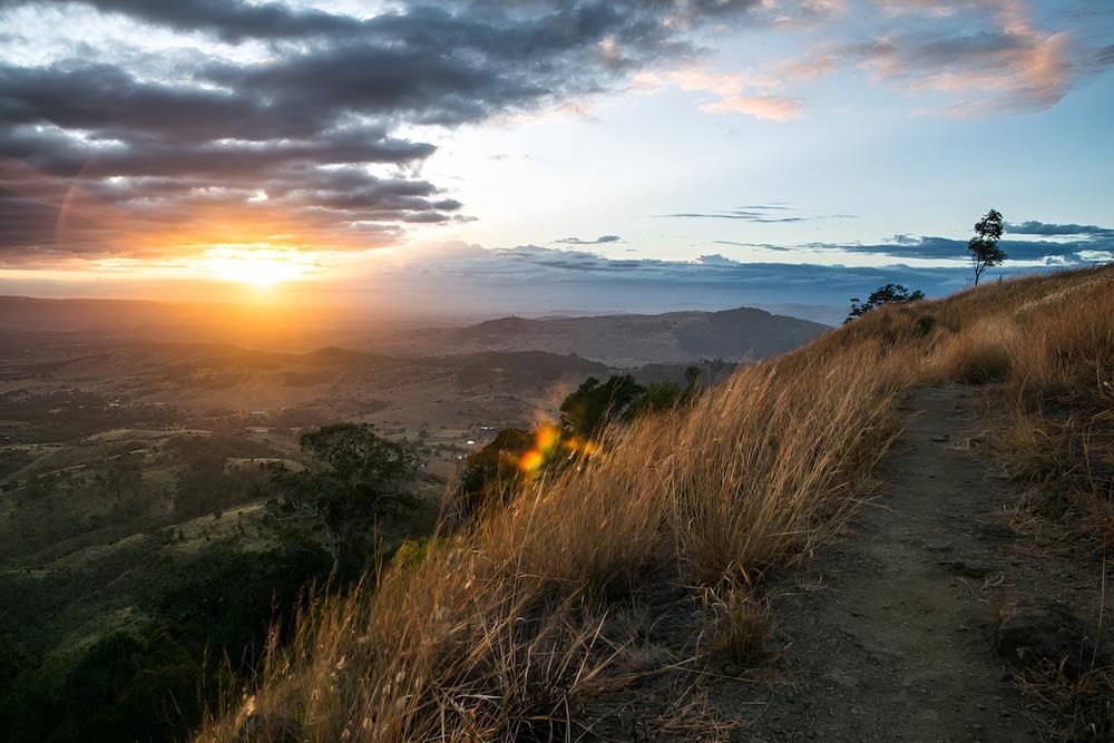 A Path Going Up a Hill With a Sunset in the Background— Balzers Removals and Carrying in Toowoomba, QLD