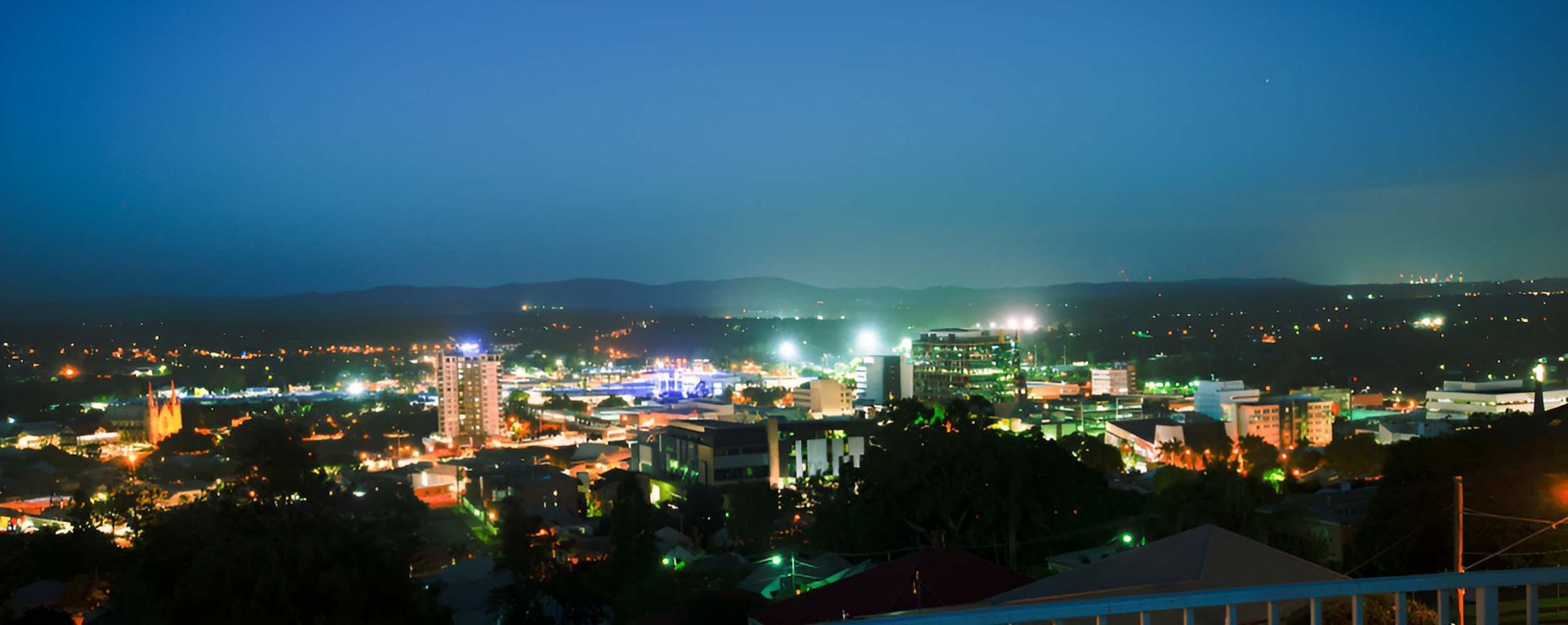 An Aerial View of a City at Night With Lots of Lights — Balzers Removals and Carrying in Ipswich, QLD