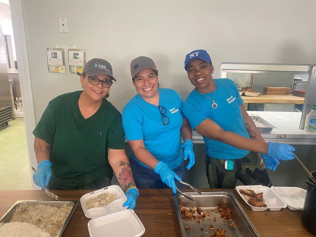 Volunteers preparing mid-day meals for our Caring Kitchen Program.