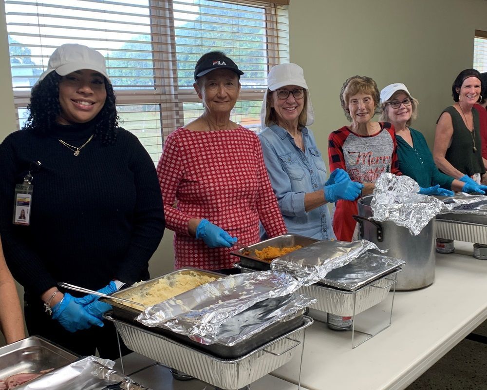 Volunteers preparing mid-day meals.