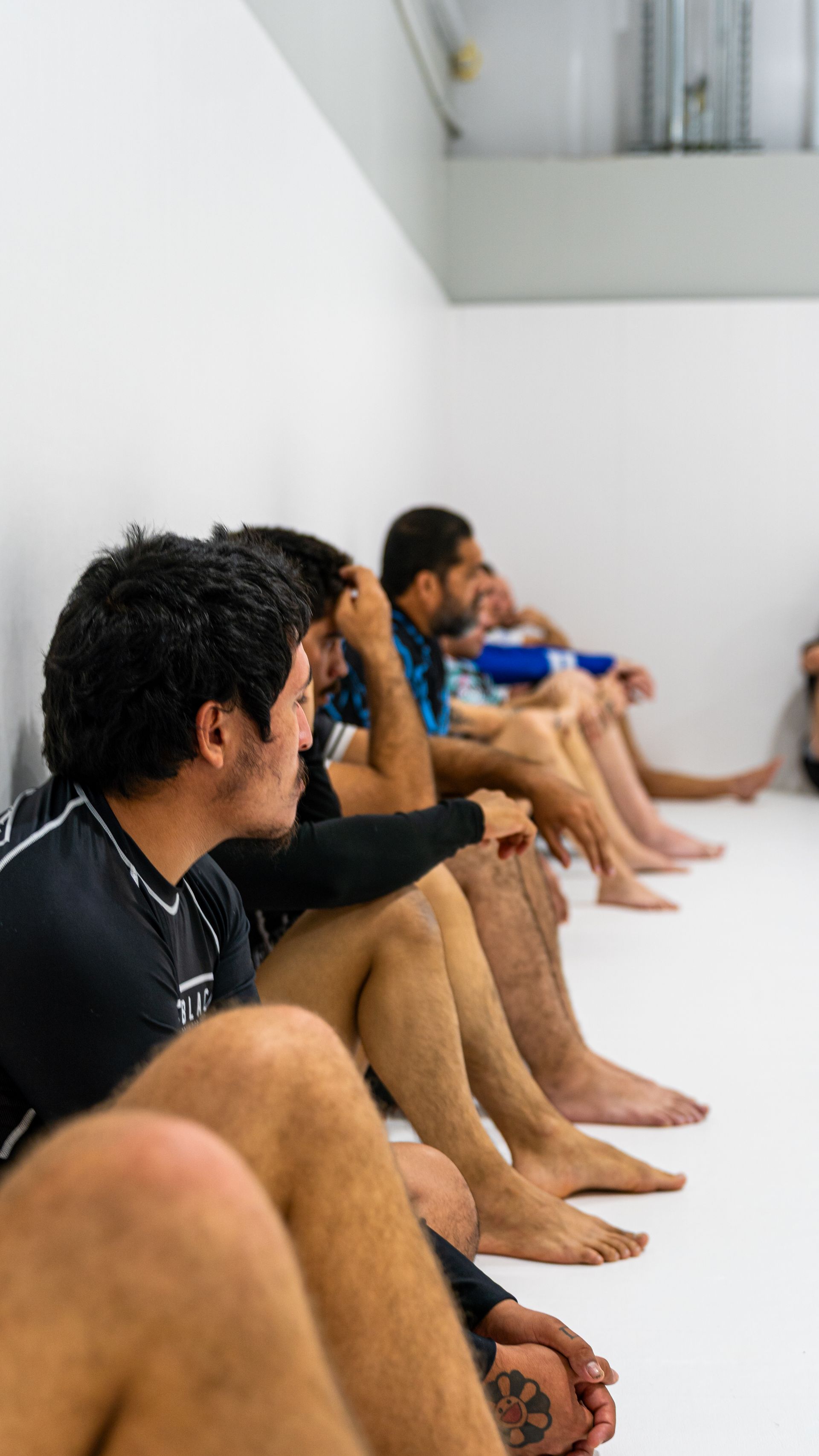 Adult students drilling no-gi Jiu Jitsu at Jiu Jitsu Hub in Georgetown, Texas for fitness and stress