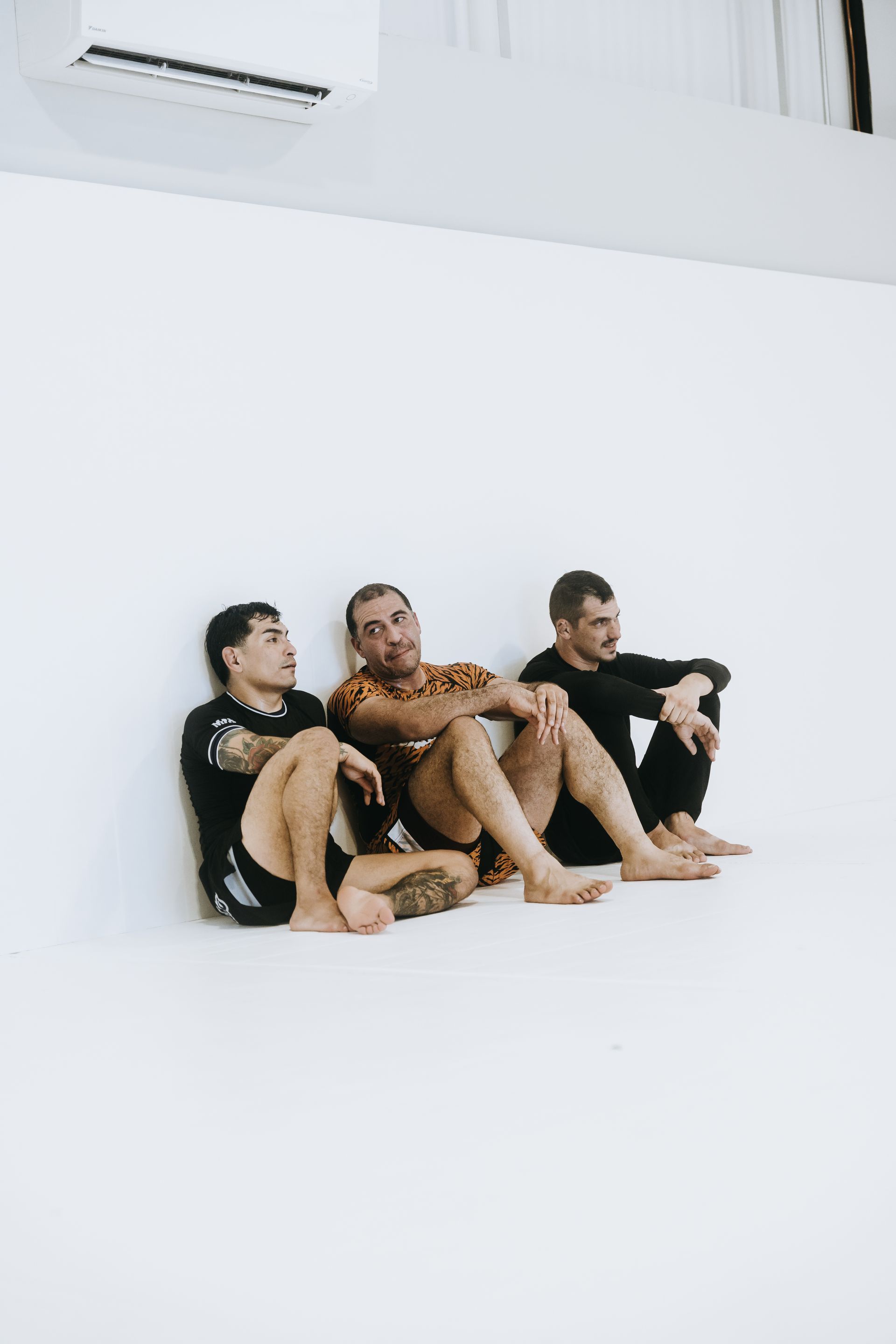 Adults drilling Brazilian Jiu Jitsu techniques at Jiu Jitsu Hub in Georgetown, Texas.