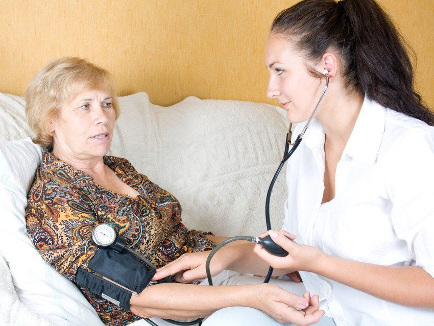 woman with nurse wearing stethoscope