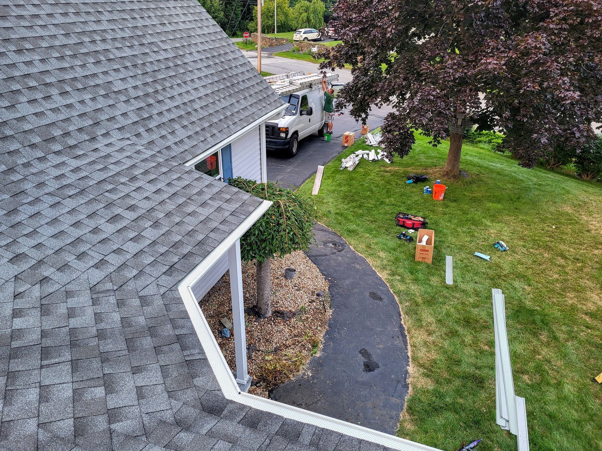 An aerial view of a house with a gutter on the side of it.