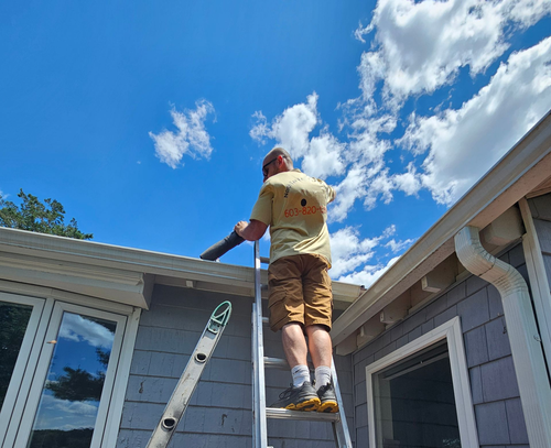 Close-up of copper seamless gutter and downspout on residential house in New Hampshire
