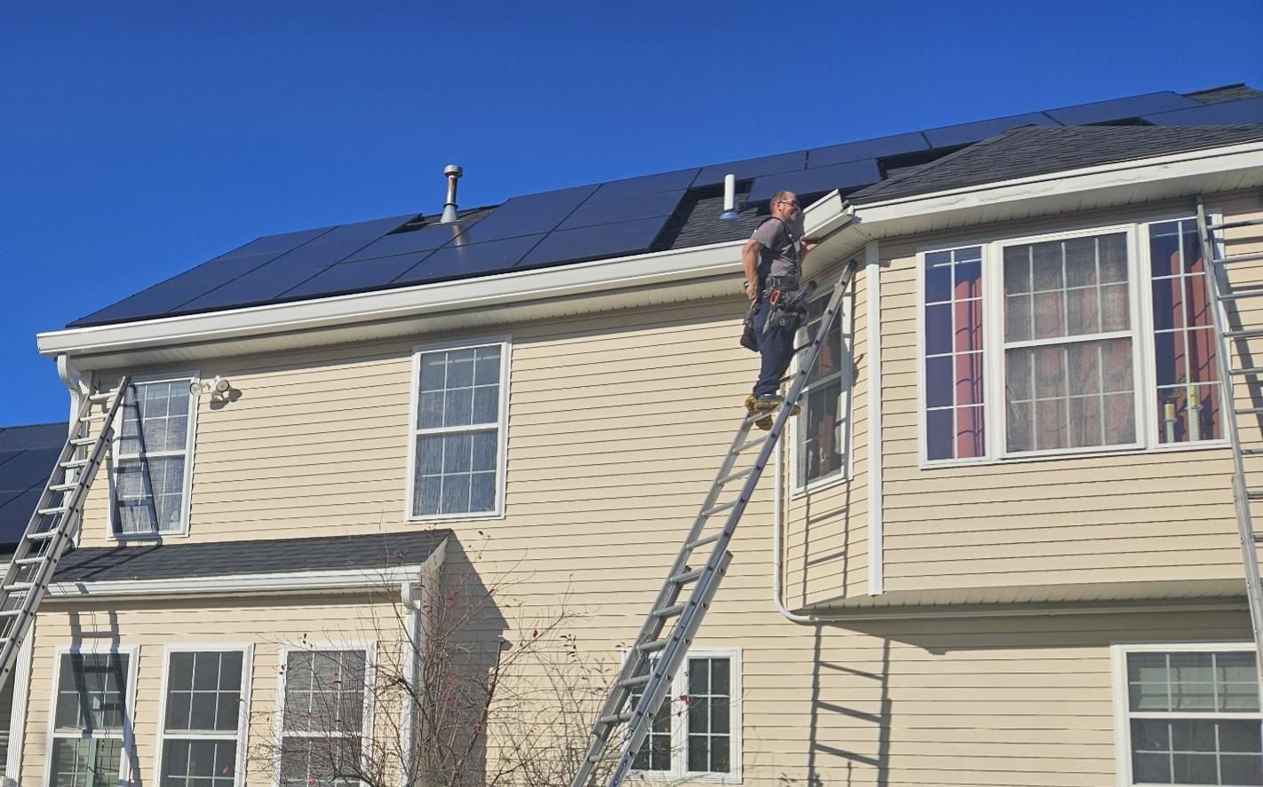 Andrew Williamson installing 6 Inch K Style gutters in high gloss white.