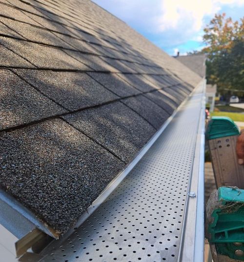 A close up of a gutter on a roof