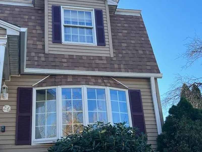 Seamless K-style aluminum gutters installed on traditional New Hampshire home