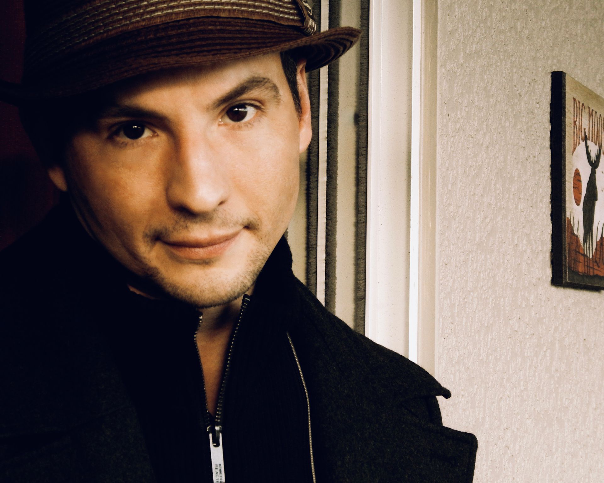 A professional photograph of Dustin Lee in sepia tones.