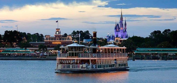 The Walt Disney World ferryboat navigates in front of the Magic Kingdom castle.