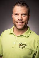 Man in a light green polo shirt, the logo of 