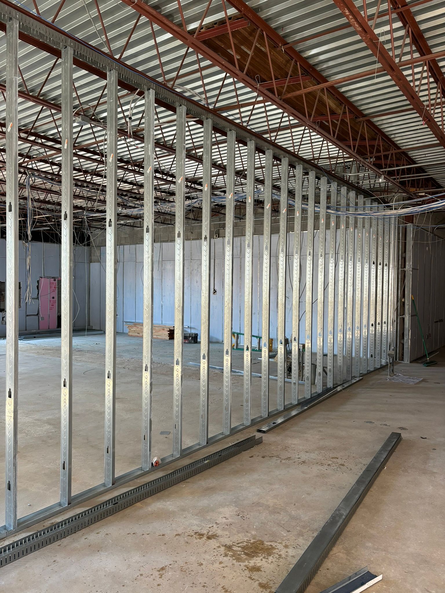 Metal framing for interior wall construction in a building under renovation.